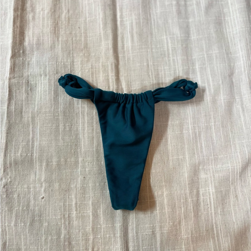 Brazilian bikinis high hip bottoms more of a turquoise blue in person